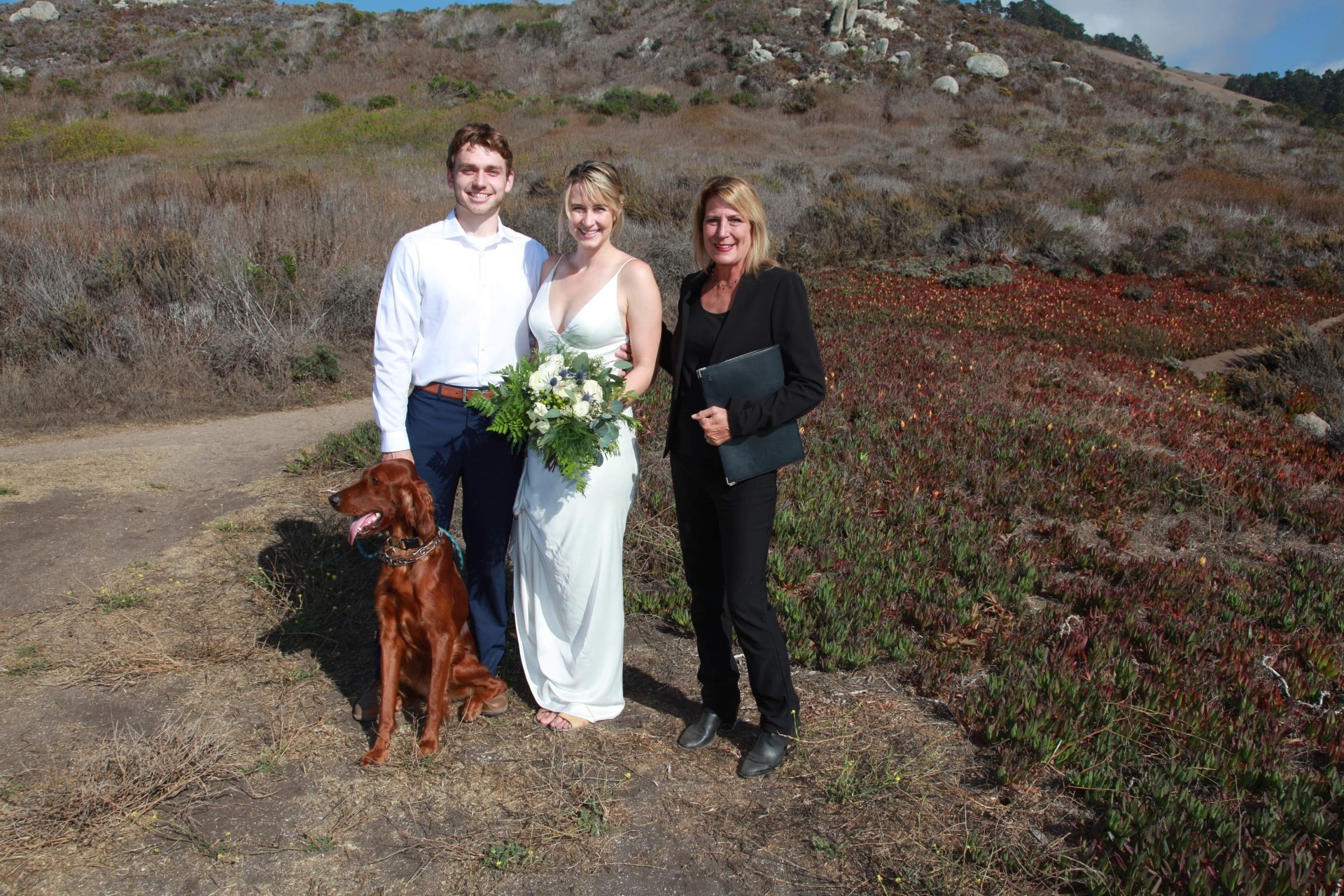 middle state beach couple with their dog and the officiant